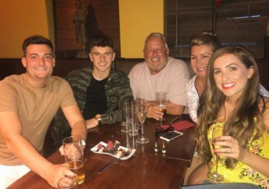 Debby Mount with her family in a restaurant.